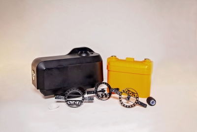 Part Name: Motorcycle Battery Housing<br>Tool Info: Low Volume Mold<br>Resin: PC/Molded In Terminals<br>&<br>Part Name: Camera Housing<br>Tool Info: Low Volume Mold<br>Resin: PC/ABS